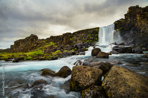 A waterfall in a beautiful Iceland landscape.