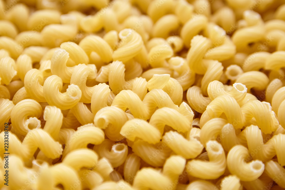 Heap of Uncooked Cavatappi Italian Pasta . Closeup, selective focus Heap of Uncooked Cavatappi Italian Pasta . Closeup, selective focus