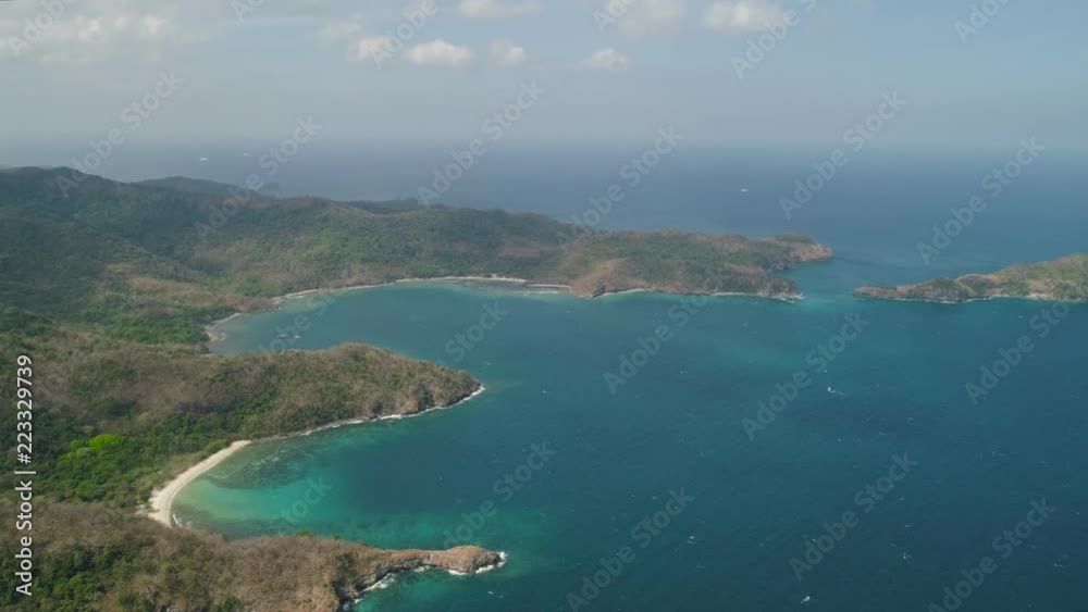 Aerial view of coast with beaches, island Limbones, lagoons and coral reefs. Neela cove, Philippines, Luzon. Coast ocean with turquoise water. Tropical landscape in Asia. Aerial view of coast with beaches, island Limbones, lagoons and coral reefs. Neela cove, Philippines, Luzon. Coast ocean with turquoise water. Tropical landscape in Asia.