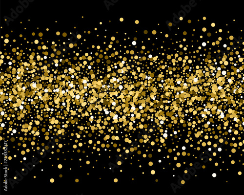 Gold sparkles on black background. Gold glitter .