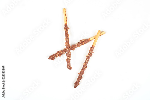 Biscuit stick with chocolate and almond isolated on white background.