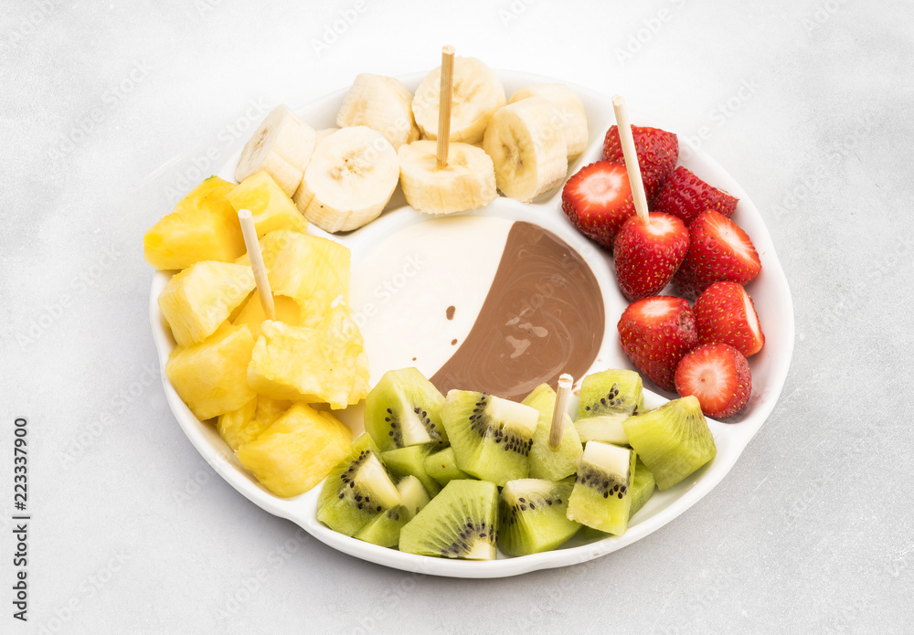 chocolate sauce and assorted of fruits. chocolate sauce and assorted of fruits.