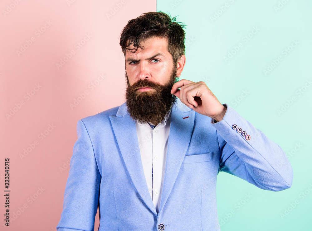 Ultimate moustache grooming guide. Expert tips for growing and maintaining moustache. Hipster handsome attractive guy with long beard. Man bearded hipster twisting mustache pink blue background Ultimate moustache grooming guide. Expert tips for growing and maintaining moustache. Hipster handsome attractive guy with long beard. Man bearded hipster twisting mustache pink blue background