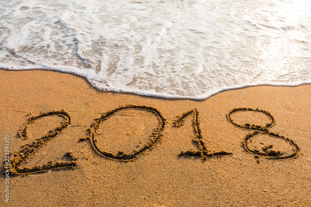 Fototapeta premium abstract 2018 on a beach sand