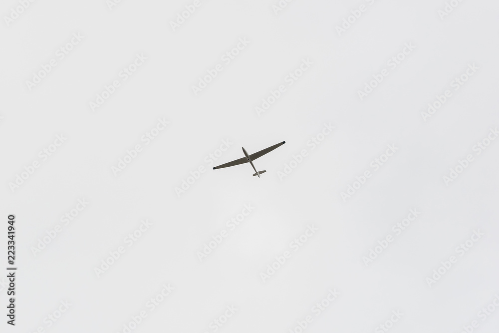 A single glider in the sky without clouds A single glider in the sky without clouds