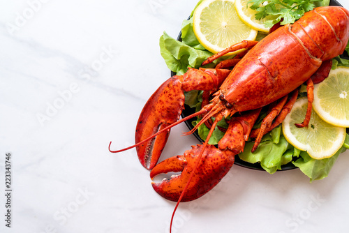 boiled lobster with vegetable and lemon photo