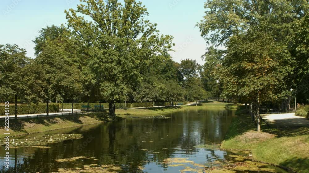 Establishing shot of the romanticly designed artificial lake in the Berlin Tiergarten park near the Brandenburg gate. Establishing shot of the romanticly designed artificial lake in the Berlin Tiergarten park near the Brandenburg gate.