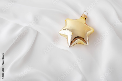 gold christmas ornament on white background