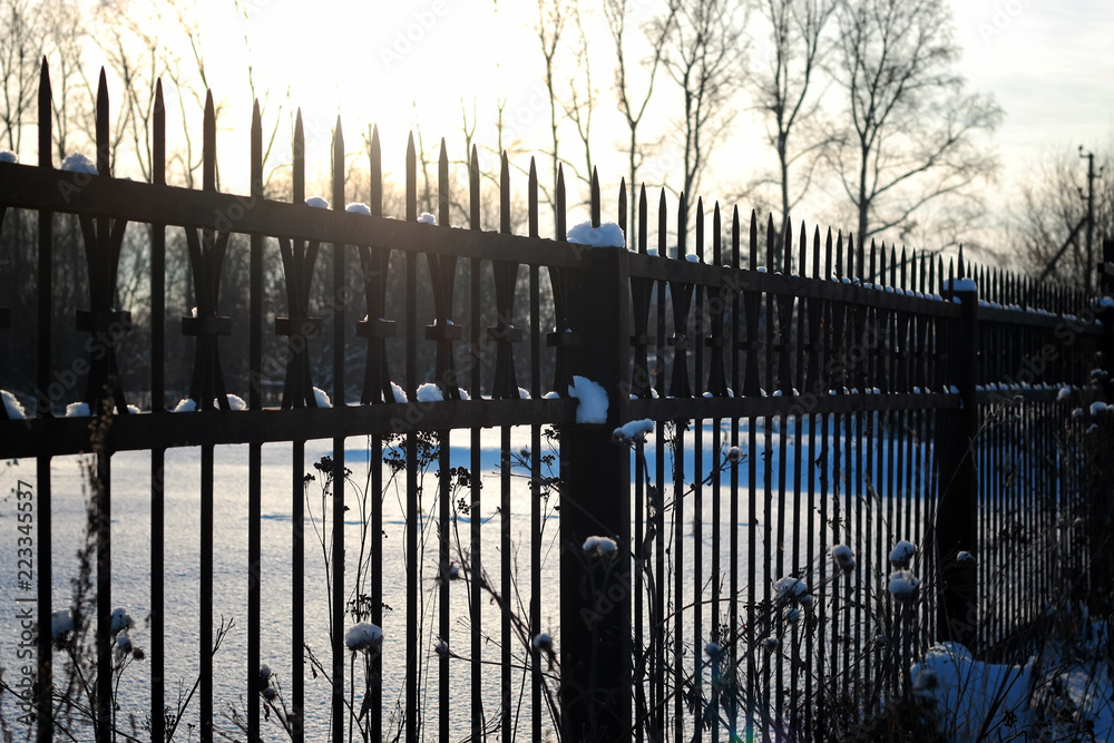 fence with spikes sun