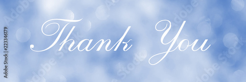 Thank You, lettering on blue blurred background of lights