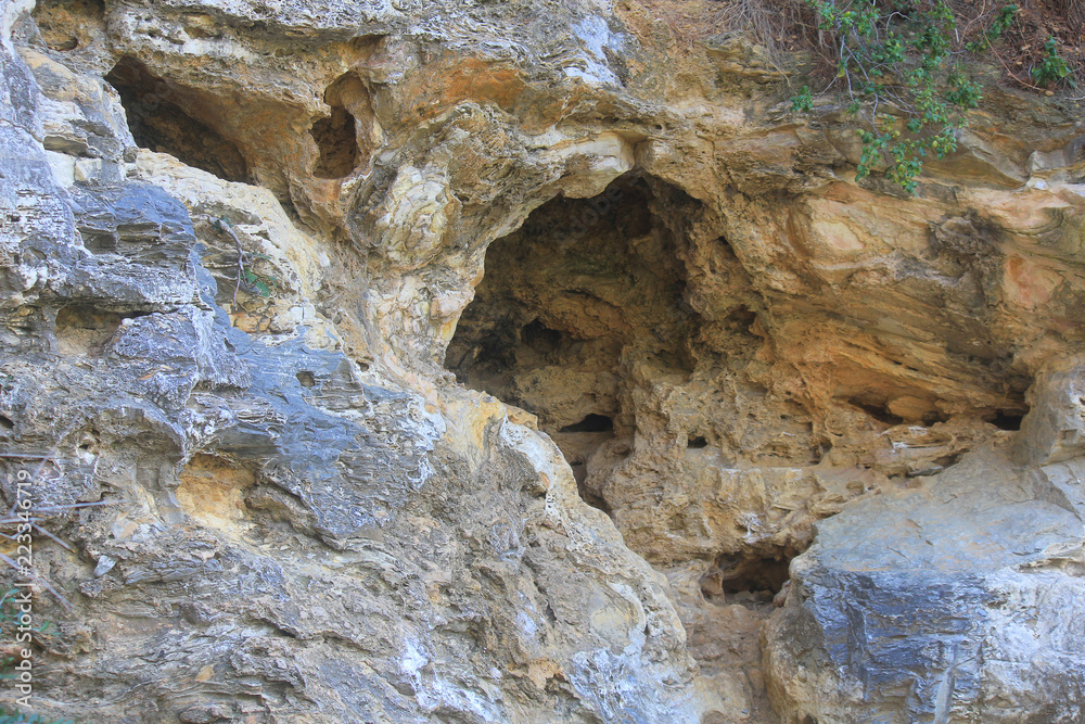 background of limestone rocks with caves