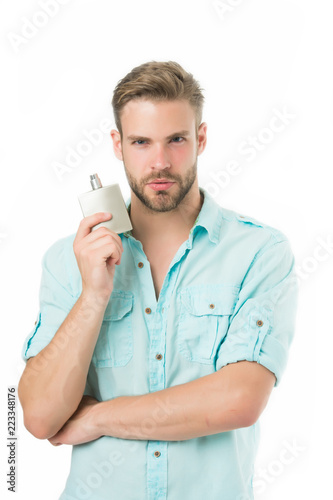 Man confident face hold perfume bottle. He likes this fragrance. Male fragrance concept. Man handsome choose pleasant fragrance for male. Everything need to know about cologne and other fragrances