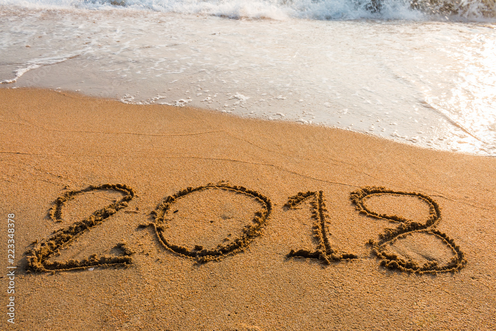 Fototapeta premium abstract 2018 on a beach sand