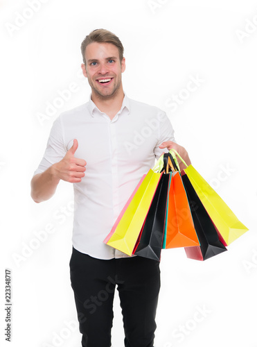 Black friday sale concept. Man formal clothes carry shopping bags. Guy happy carry bunch shopping bags. Profitable deals on black friday. Man hold lot paper bags packages after shopping in mall