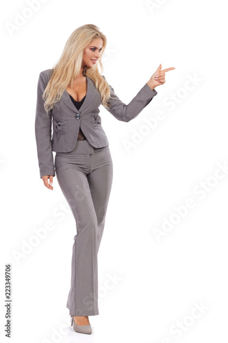 Business Woman In Gray Suit Is Standing And Directing
