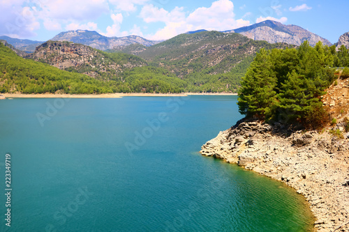 landscape with a lake in the mountains on a sunny day