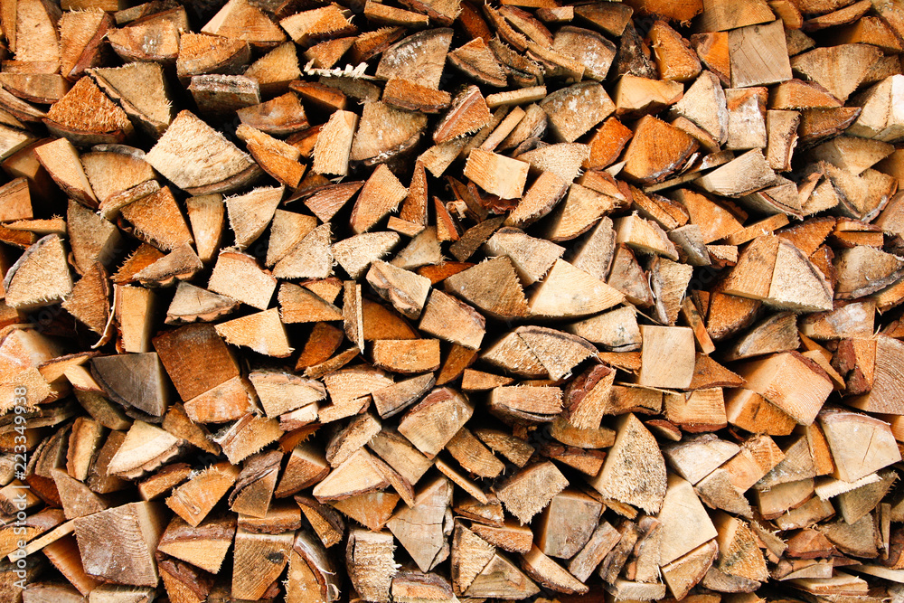 Beautiful wood stacked in a garage shelter near a countryside home. Beautiful wood stacked in a garage shelter near a countryside home.