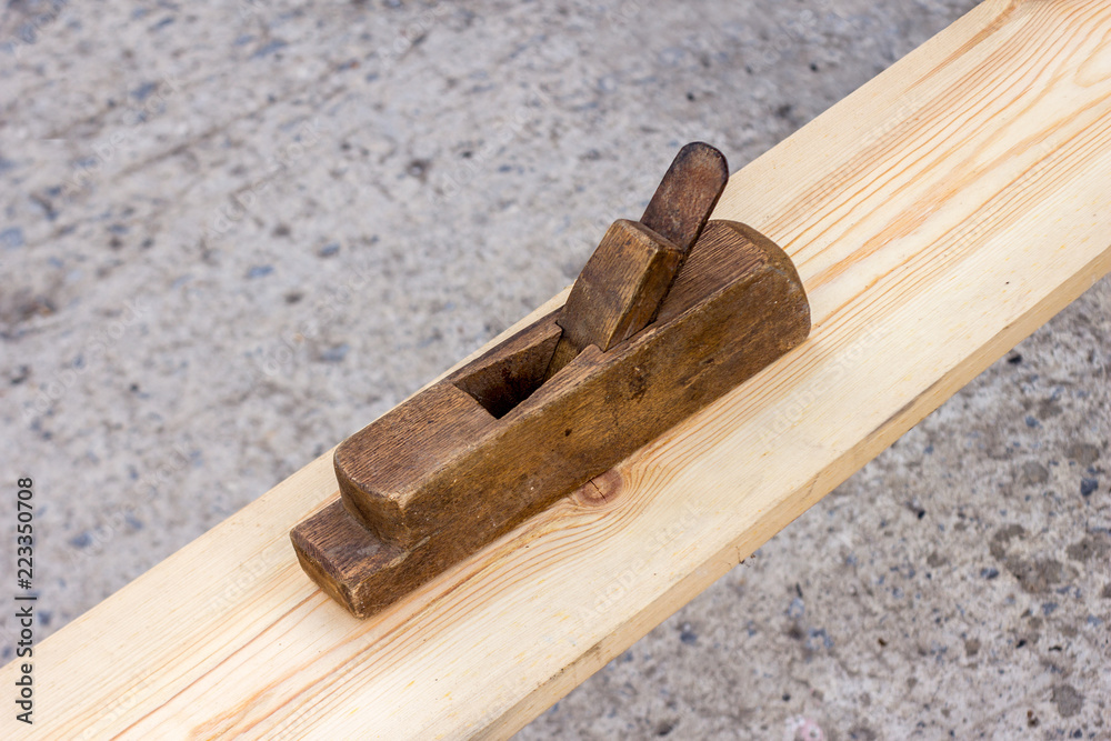A hand plane is a tool for shaping wood using muscle power to force the cutting blade over the wood surface. A hand plane is a tool for shaping wood using muscle power to force the cutting blade over the wood surface.
