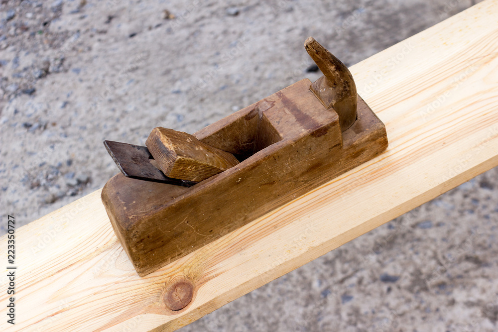 A hand plane is a tool for shaping wood using muscle power to force the cutting blade over the wood surface. A hand plane is a tool for shaping wood using muscle power to force the cutting blade over the wood surface.