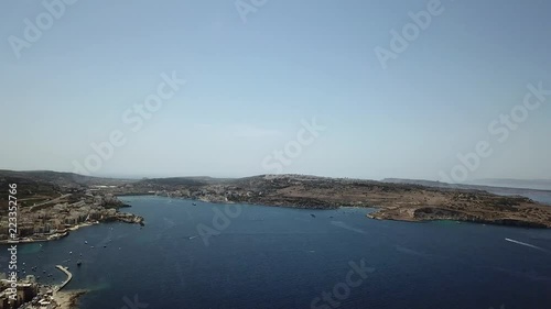 Aerial pan from sea to Buggiba city in Malta. photo