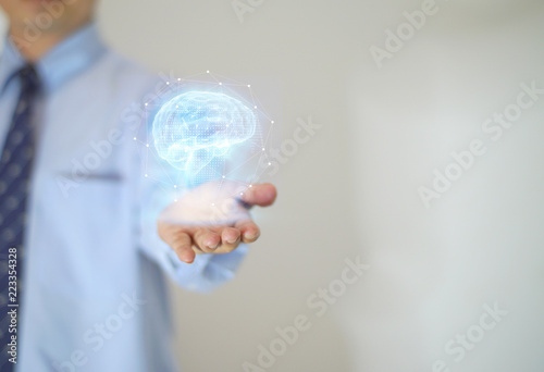  Hand operating digital image of human brain with gesture interface technology.