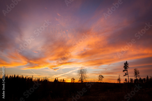 Beautiful vibrant sunset clouds view landscape in finland