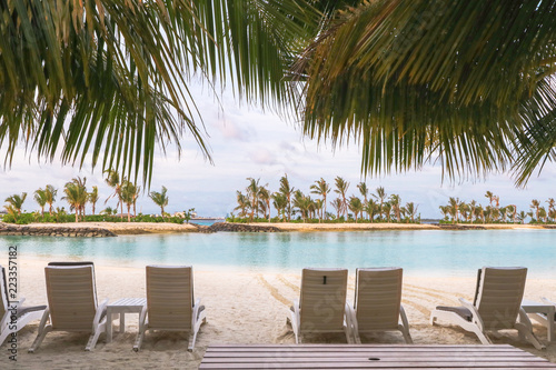 Amazing island in the Maldives  Beautiful turquoise waters and white sandy beach with  blue sky  background for holiday vacation .