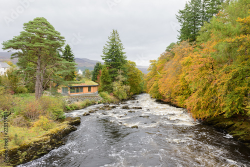 The river Dochart in spate as it crashes over the Falls of Dochart in Killin, Pertshire, Scotland. photo