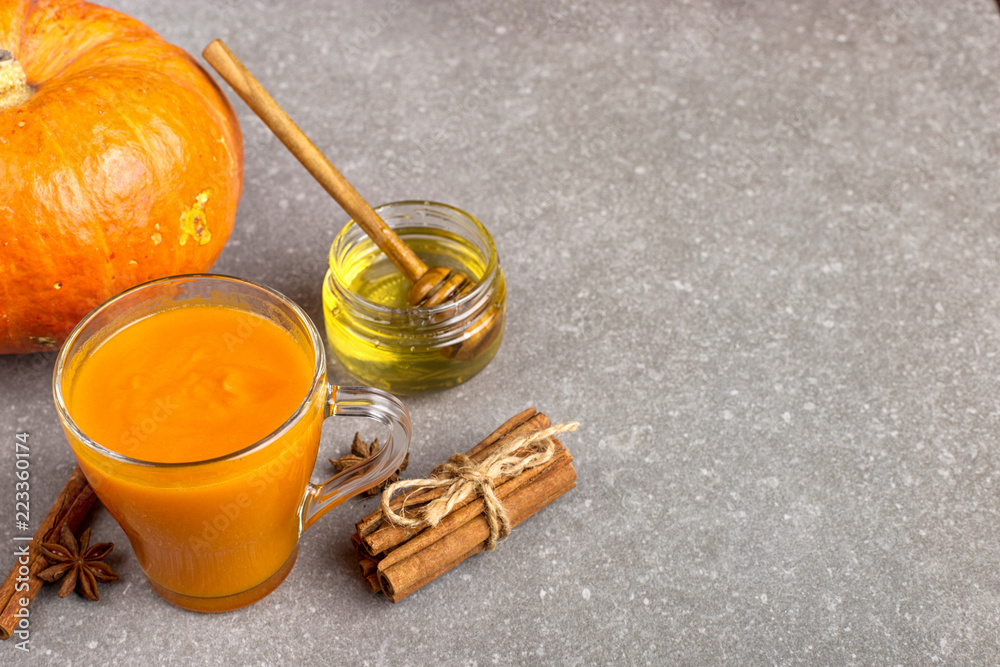 Fototapeta premium Pumpkin smoothie for Thanksgiving, autumn drink. Copy space.