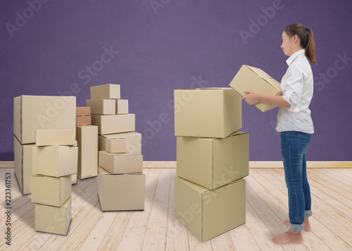 woman carrying and lifting boxes