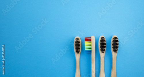 Toothbrushes on blue background. Concept of racism  social exclusion  depression or loneliness  social problems or illegal migration