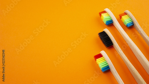 Toothbrushes on orange background on orange background. Concept of racism  social exclusion  depression or loneliness  social problems or illegal migration
