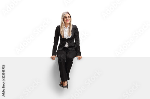 Businesswoman sitting on a panel and smiling