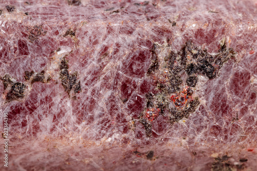 Macro mineral stone Ruby in the breed a white background