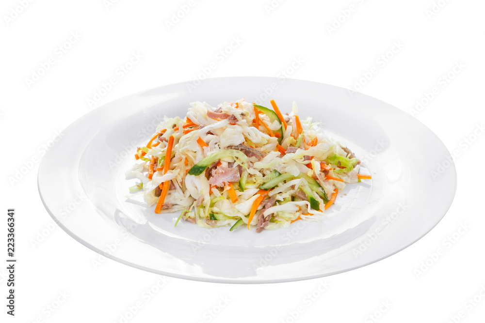 Salad of vegetables with cucumber, carrots, cabbage, meat, ham, bacon on plate, white isolated background Side view. For the menu, restaurant, bar, cafe Salad of vegetables with cucumber, carrots, cabbage, meat, ham, bacon on plate, white isolated background Side view. For the menu, restaurant, bar, cafe