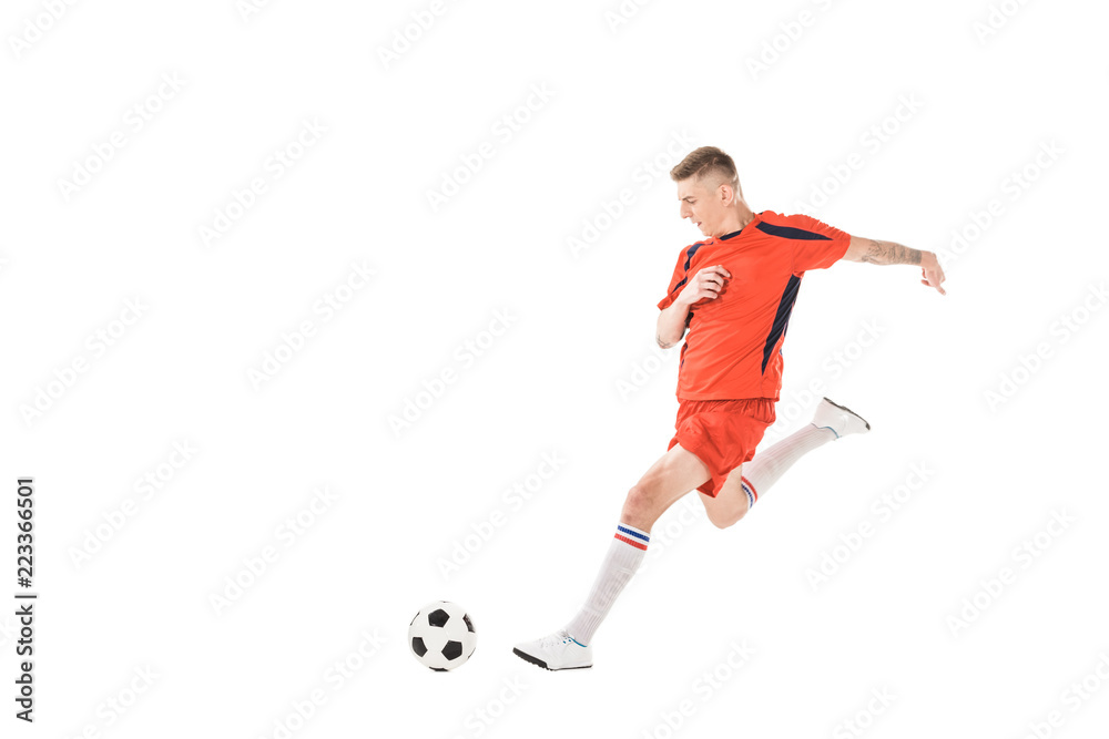 full length view of young sportsman playing soccer isolated on white
