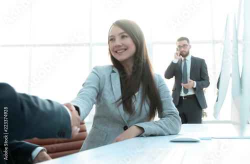 female consultant greeting the customer .