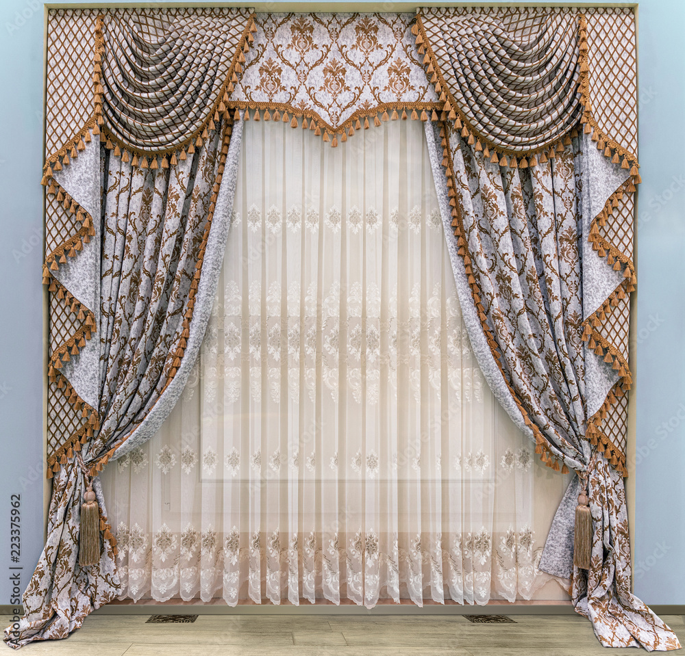 Elegant curtains in a classic, palace style. Semi-transparent tulle with  floral ornament. Combined, two-sided curtains with a lambrequin and a jabot  Stock Photo | Adobe Stock