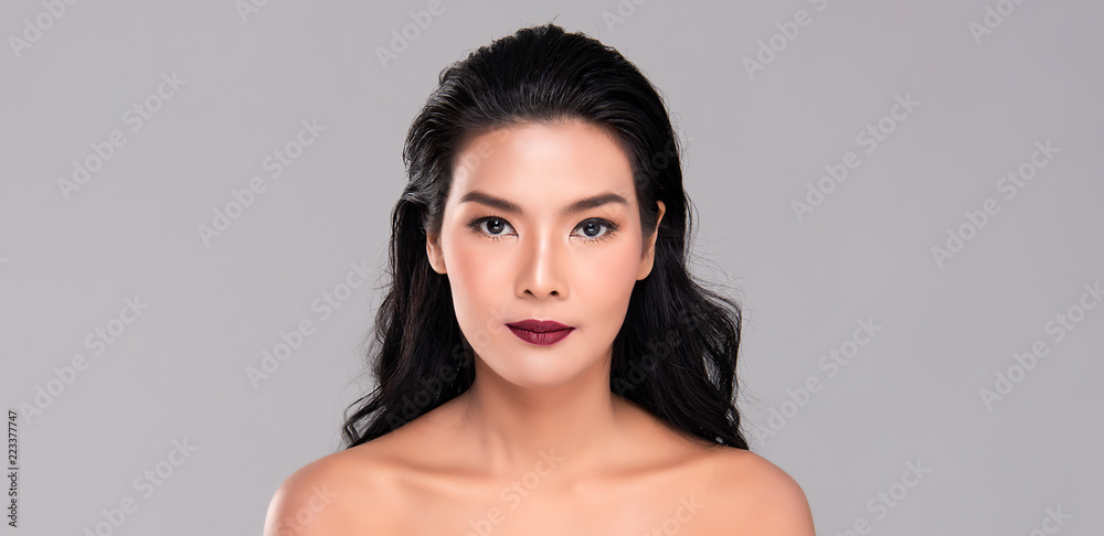 Naklejka premium Young asian woman with clean skin of the face
