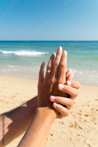 Young Happy Couple Is Getting Engaged In Wedding Proposal On Exotic Beach