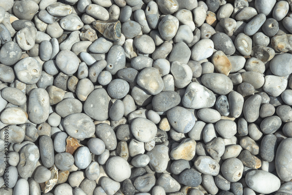 All rounded tiny pebbles from beach, a natural summer background, smooth polished pebble stones All rounded tiny pebbles from beach, a natural summer background, smooth polished pebble stones