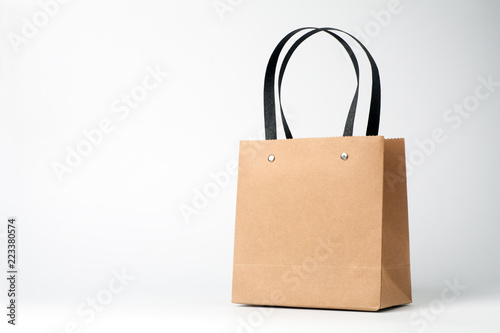 Brown paper shopping bag on white background