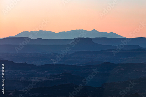 Fototapeta Naklejka Na Ścianę i Meble -  Last Light Of A Sunset Over Many Layers Of Canyons In Moab Utah