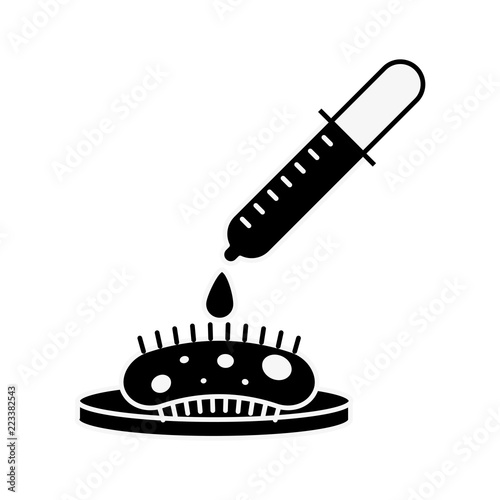 dropper pouring reagent on virus petri dish test