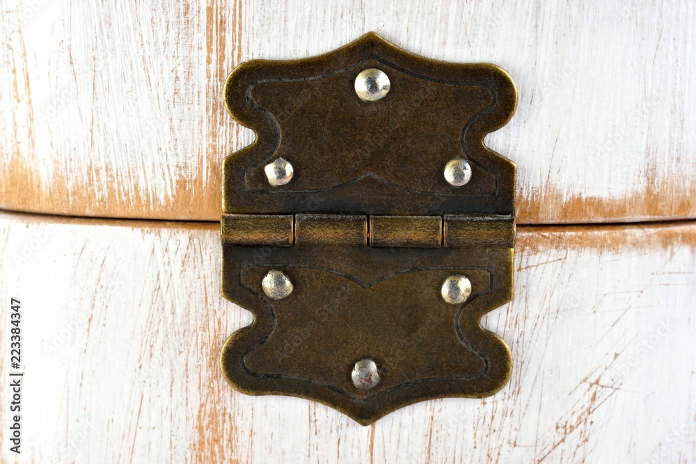 Old rustic hinge on box with white scratched paint / Hinge background Old rustic hinge on box with white scratched paint / Hinge background