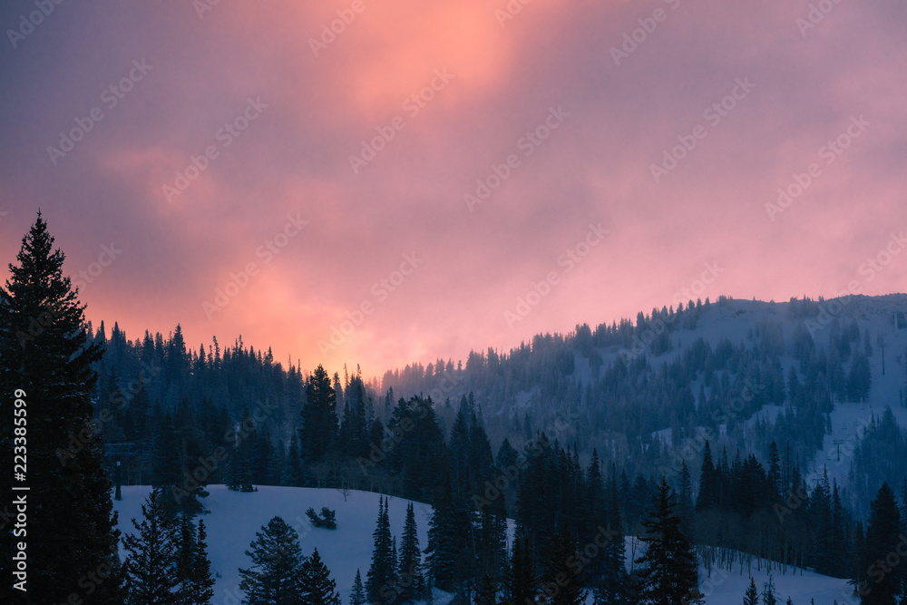 Obraz premium Sunrise Over A Snowy Mountain Ski Resort