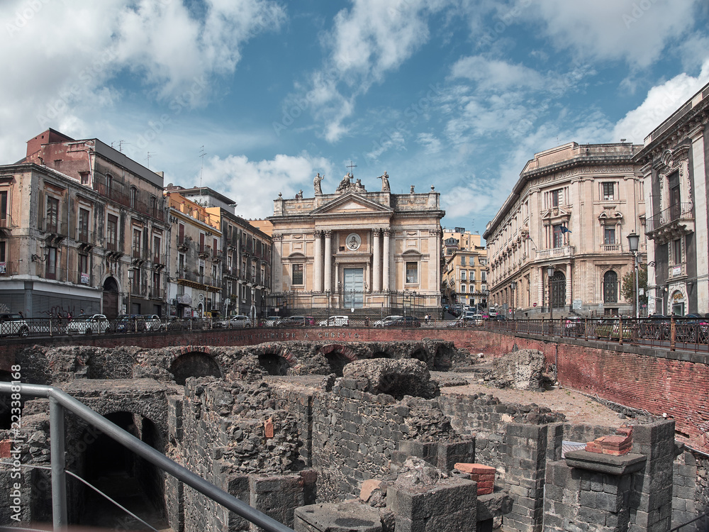 Shot of the Roman Anphitheater in Piazza Stesicoro in Catania in a summer day. Catania, Sicily
