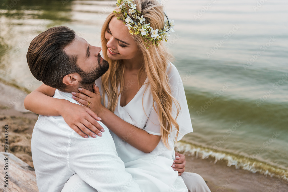 smiling elegant bride and groom going to kiss on beach smiling elegant bride and groom going to kiss on beach