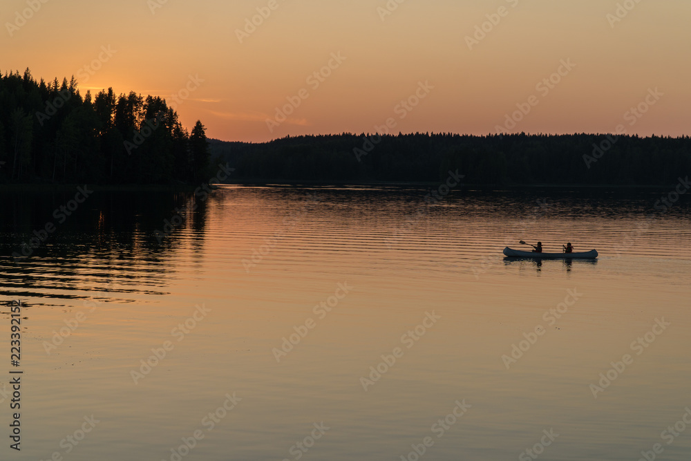 Midnight sun on lake