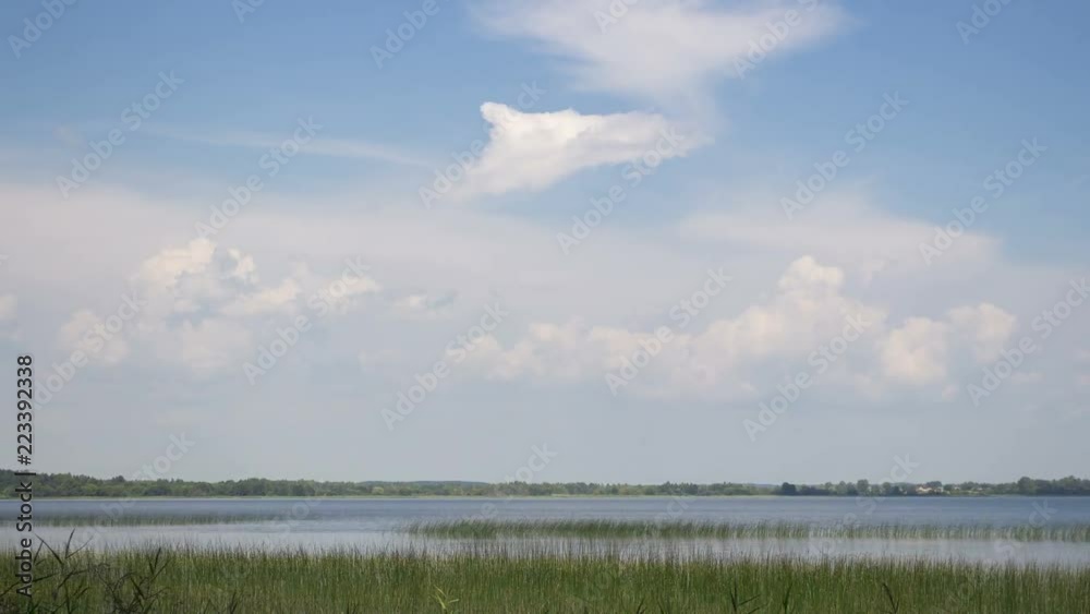 Storm clouds over lake, dramatic sky, time-lapse 4K. Storm clouds over lake, dramatic sky, time-lapse 4K.